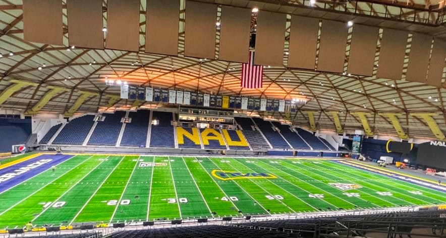 An indoor football stadium under bright, even lighting