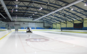 Small hockey arena lit with LED lighting