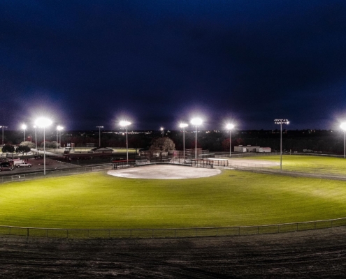 Baseball field lit up at night